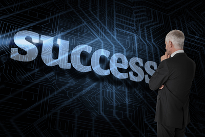 The word success and thoughtful businessman standing back to camera against futuristic black and blue background
